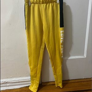 Yellow Joggers With Black Stripes On The  Sides